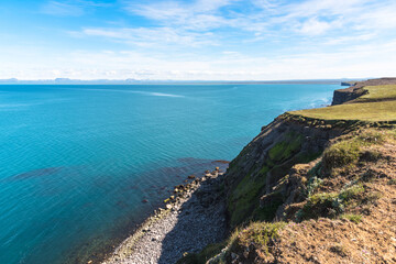 View of a rugged coast in Iceland on a sunny summer day