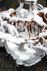 ice figurines, iced tree, branches in icy glaze, frozen water in icicles, ice patterns, winter landscape  