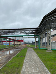 Obraz premium Industrial Steel pipelines, valves, cables and walkways