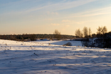 Beautiful snowy winter landscape with white field