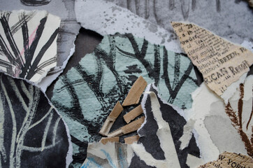 Graphic texture of charcoal sangina watercolor ink collage on a black background.