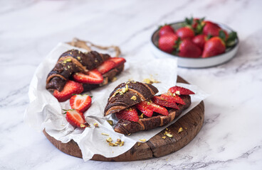 Croissant with chocolate cream and strawberry