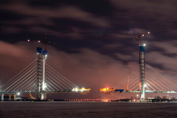 Fototapeta premium Building a bridge across a river