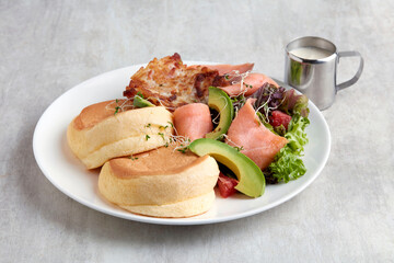 Kiseki Pancake Avocado Salmon in white plate on grey background