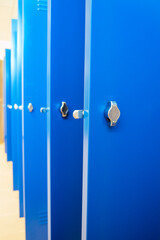 Close-up and general view of new metal lockers in a warehouse locker room