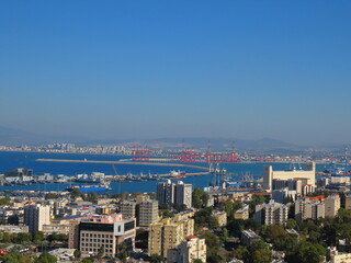 Fototapeta na wymiar Beautiful top view of mediterranean sea, seaport, and modern architecture in Haifa, Israel.