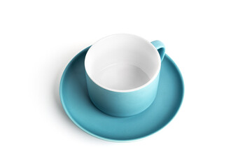Blue tea cup and saucer for drink isolated on white background. Ceramic coffee cup or mug close up.