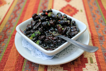 Fototapeta na wymiar Homemade Tasty and Healthy Black Bean Dip in a White Dipping Bowl