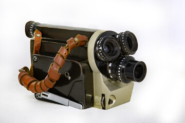 USSR vintage movie camera with three lenses on a white background