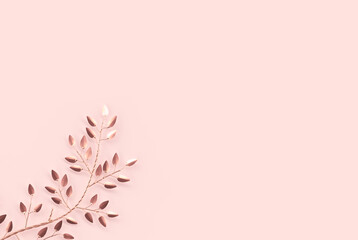 Elegant and minimalist style 3D rendering of golden branches and leaves on rose gold background