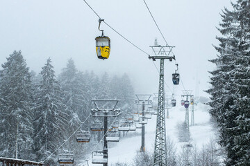 Bocksberg cable car and ski lift on a foggy winter morning, Hahnenklee, Goslar, Lower Saxony,...