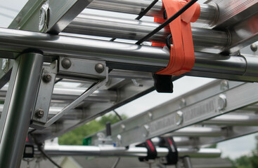 Close up of ladders on a ladder rack. 
