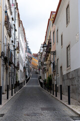 Fototapeta na wymiar Traditional cobbelstone street building architecture in Lisbon Portugal