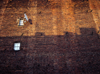 brick wall with two windows