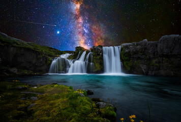 Colorful waterfall with milky way