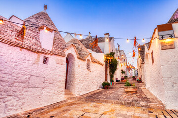 Famous Trulli Houses in Alberobello Illuminated at Dusk, Puglia