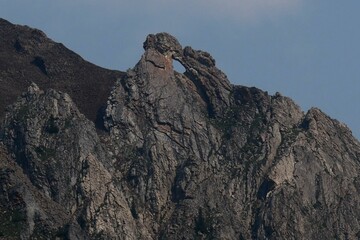 Hole in rock in the misty Range near Highwood Pass at Kananaskis