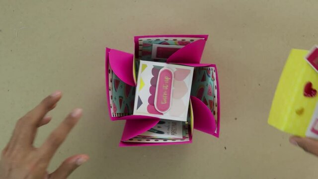 Hands Opening valentine surprise scrapbook box