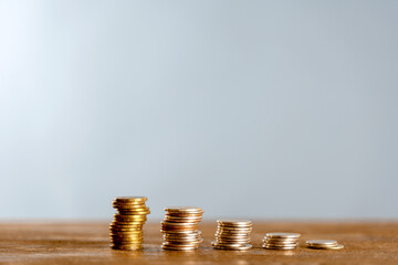 coins in the form of a graph of growth or decline in