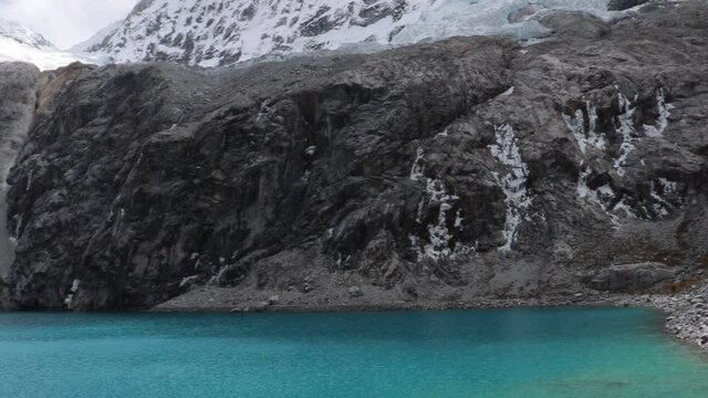 Lagone 69 in the Andes of Peru with beautiful water and lots of ice