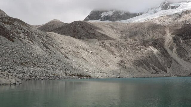 Lagone 69 in the Andes of Peru with beautiful water and lots of ice