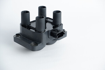 Auto parts. Car ignition coil on a white background close-up. Ignition coil for gasoline...