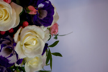 Floral background. Bouquet of multi-colored roses close-up. background of bright multi-colored roses. Colorful romantic decoration of assorted roses.