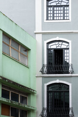 Close-up of 50s apartment building with coloured render facade