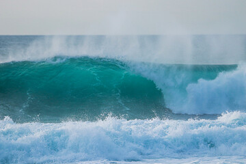 Perfect wave breaking in a beach. Surf spot