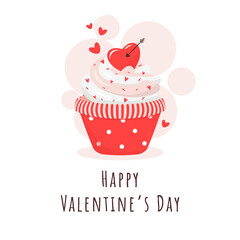 Cupcake for Valentine's Day decorated with hearts and cupid arrow.