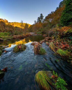 Mestres weir of Piscaredo hiking path on an autumn fall landscape