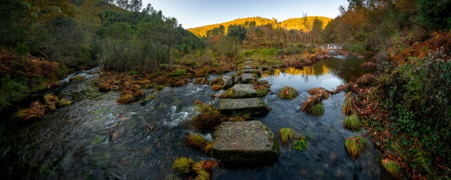 Mestres weir of Piscaredo hiking path on an autumn fall landscape - Powered by Adobe