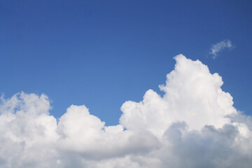Naklejka na ściany i meble Clouds, blue sky, bright Sun