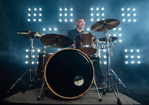 drummer performing in front of audience blinder
