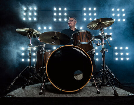 drummer performing in front of audience blinder