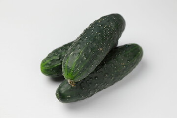 Organic cucumbers on a white background.