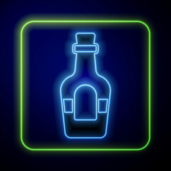 Glowing neon Alcohol drink Rum bottle icon isolated on blue background. Vector