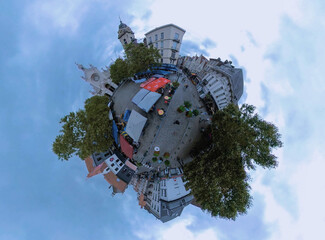 Little planet view of the old town in Brussels, Belgium on a cloudy day in summer.