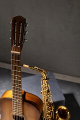 Acoustic guitar and saxophone in studio. Music concept with musical instrument
