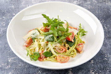 italian pasta with pesto and tomatoes