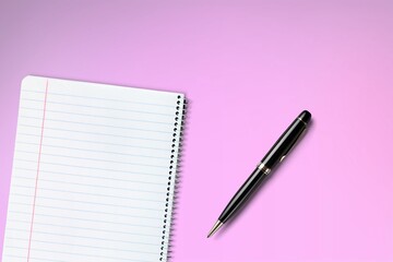 Office pen and notebook on background is equipment for using drawing and writing notes in.