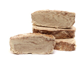 Tahini halvah, sesame paste, slices isolated on white 