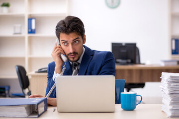 Young male employee working in the office