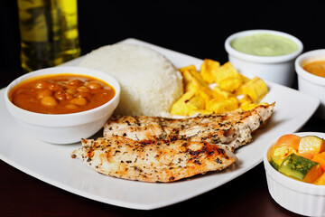 typical ecuadorian food chicken and rice with stew