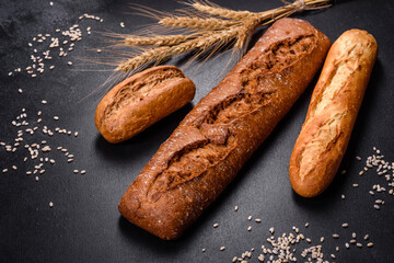 Fresh Bread on black background, top view, copy space