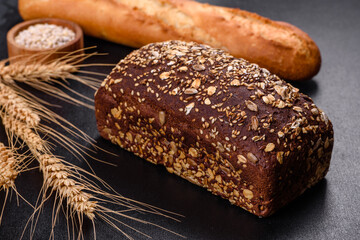 Fresh Bread on black background, top view, copy space