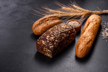 Fresh Bread on black background, top view, copy space