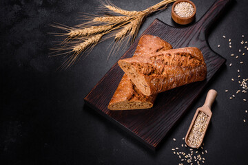 Fresh Bread on black background, top view, copy space