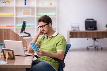Young male designer working in the office