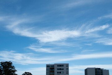  A Vibrant atmospheric cloudy sky cloudscape with white coloured wispy cirrus cloud formation in a...
